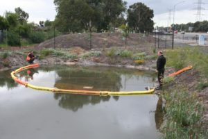 Oil and fuel spill boom on water